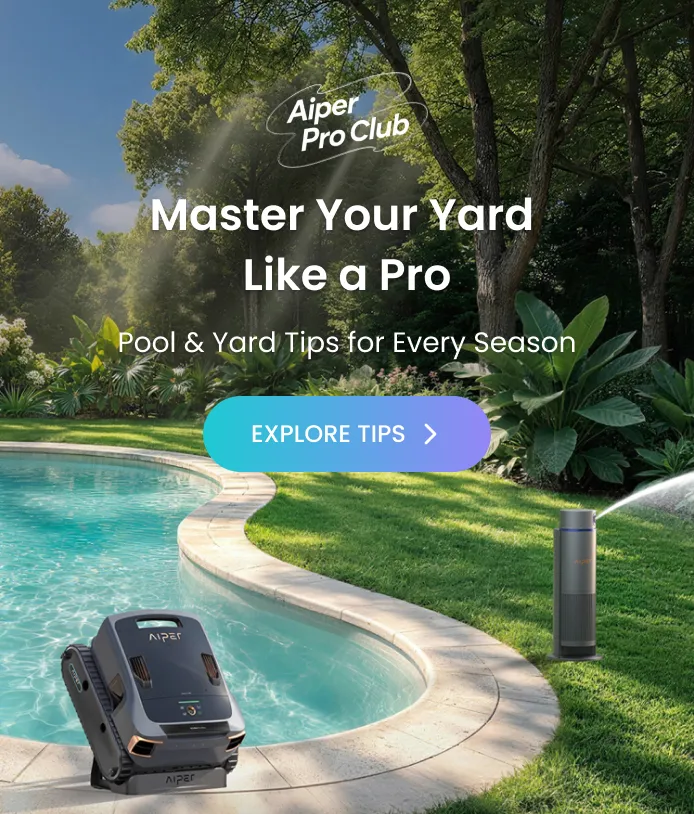 An Aiper robotic pool cleaner sits on the edge of a backyard swimming pool.